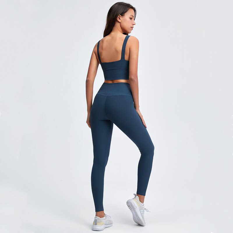 Conjunto deportivo acanalado de top y leggings para mujer