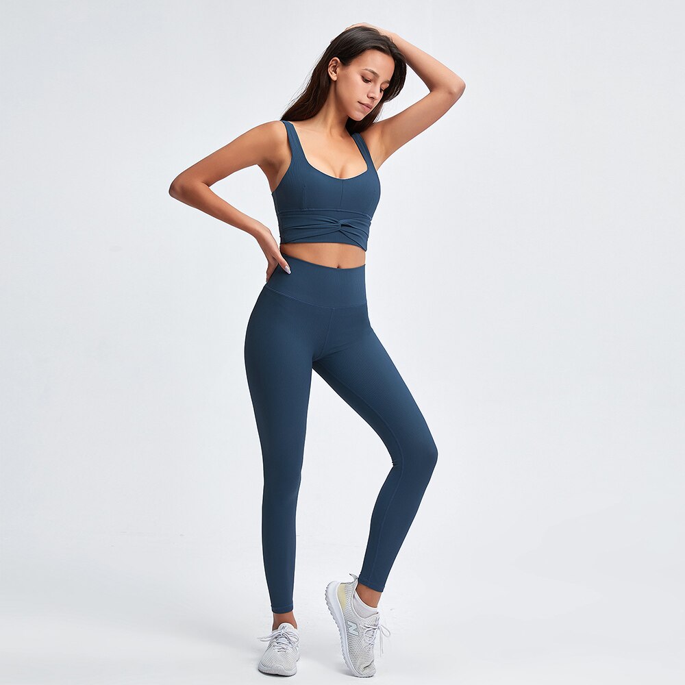 Conjunto deportivo acanalado de top y leggings para mujer