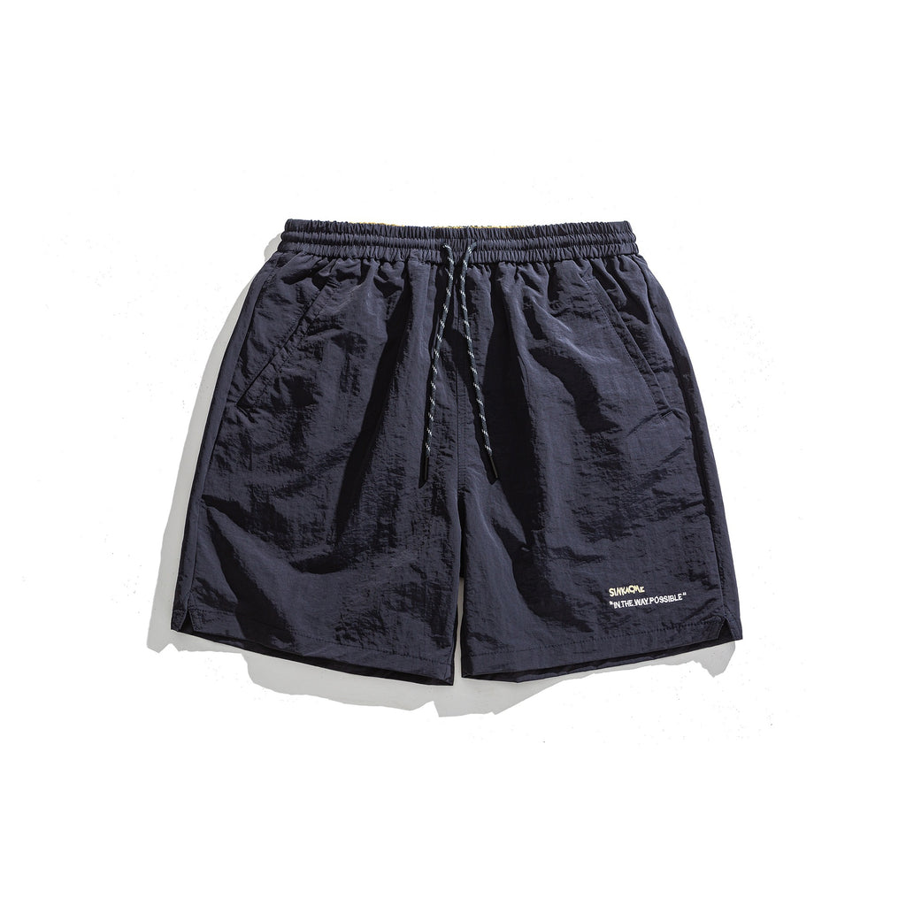 Pantalones cortos deportivos holgados con diseño de bordado de letras sencillo
