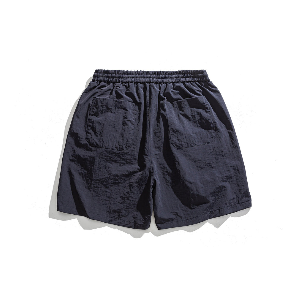 Pantalones cortos deportivos holgados con diseño de bordado de letras sencillo