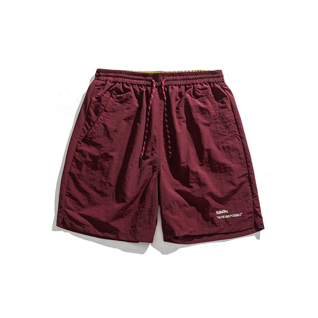 Pantalones cortos deportivos holgados con diseño de bordado de letras sencillo