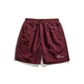 Pantalones cortos deportivos holgados con diseño de bordado de letras sencillo