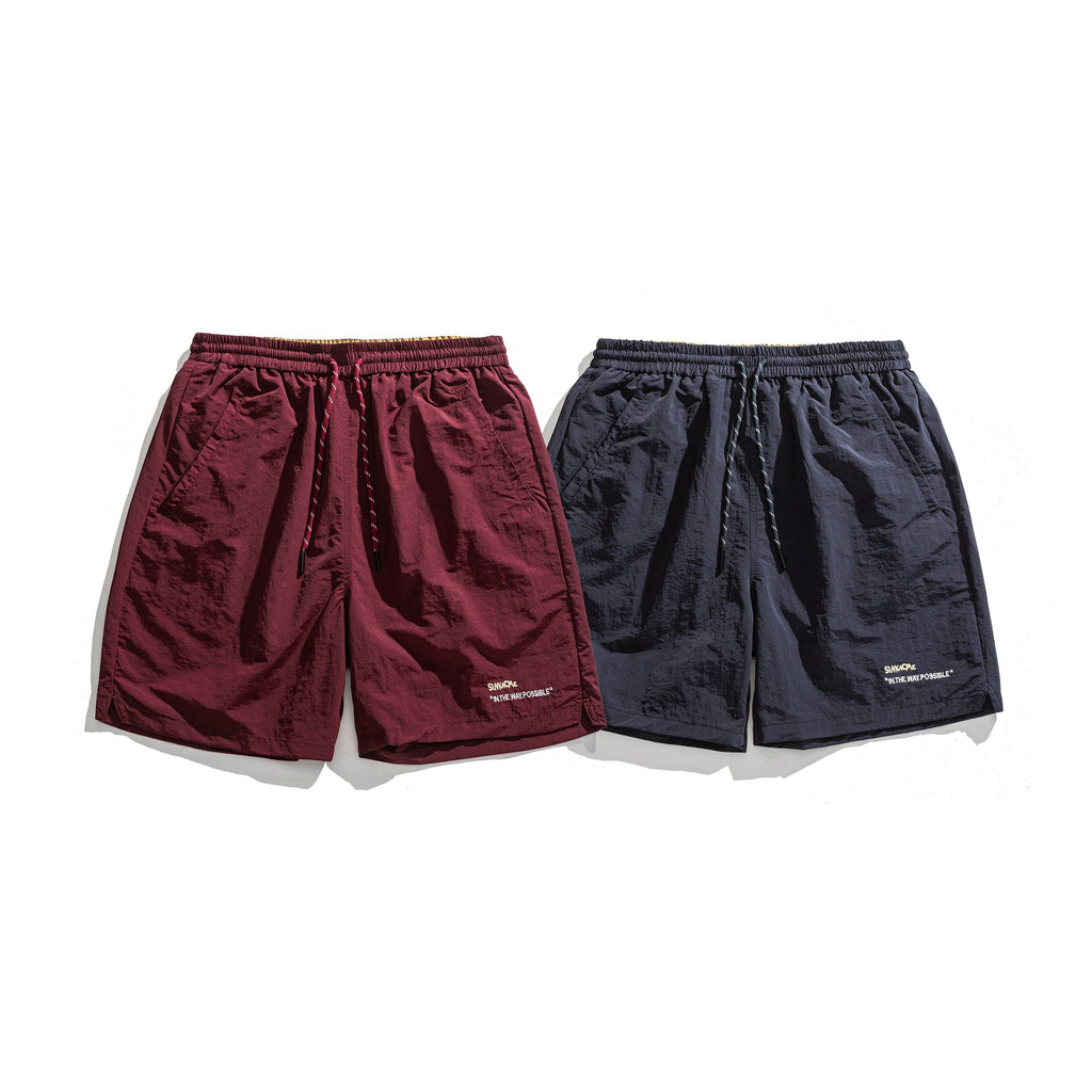 Pantalones cortos deportivos holgados con diseño de bordado de letras sencillo