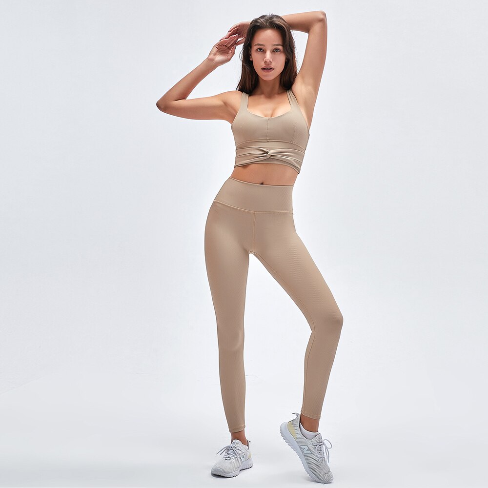 Conjunto deportivo acanalado de top y leggings para mujer